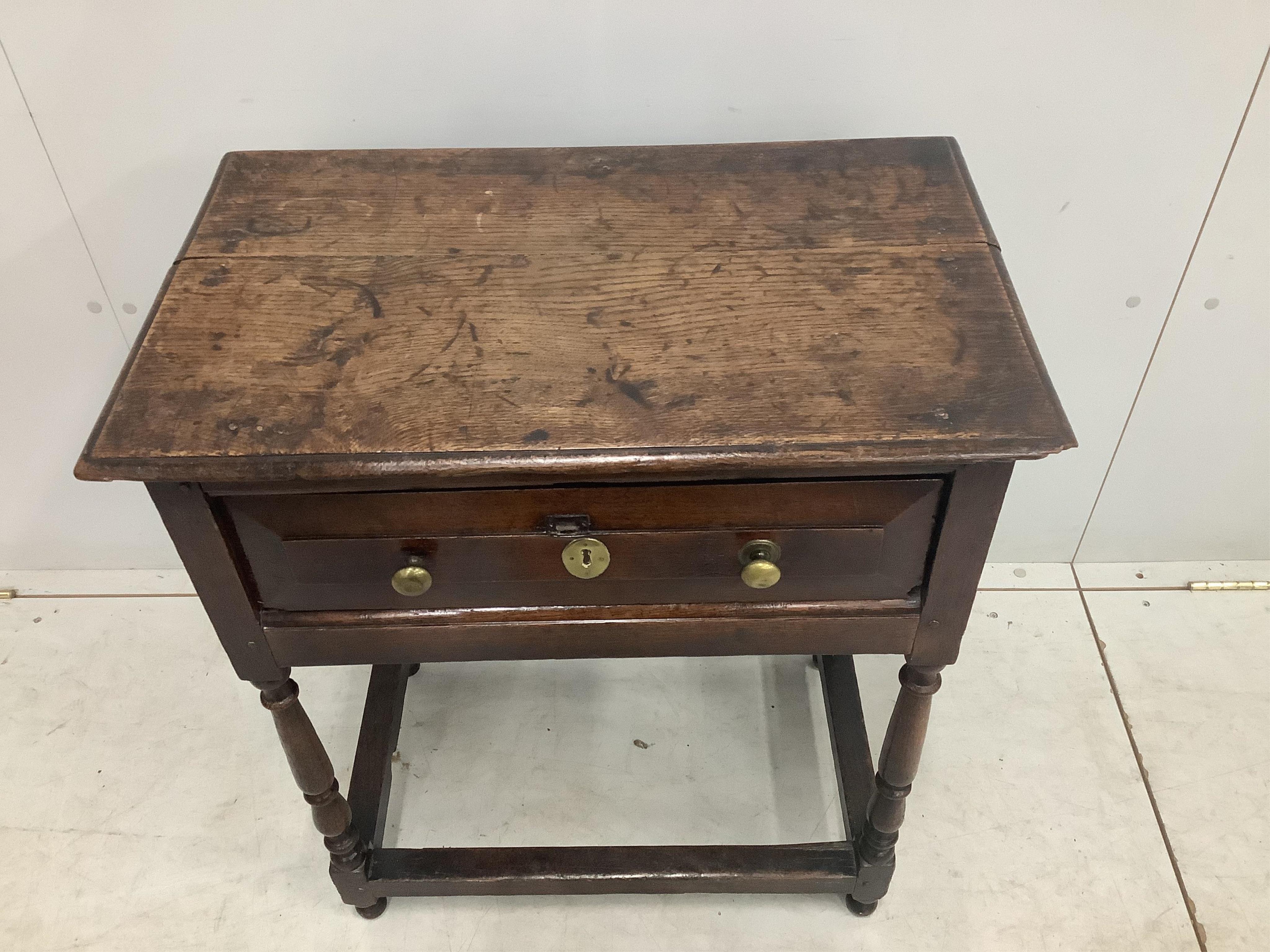 A small 18th century single drawer oak side table, width 65cm, depth 40cm, height 75cm. Condition - fair